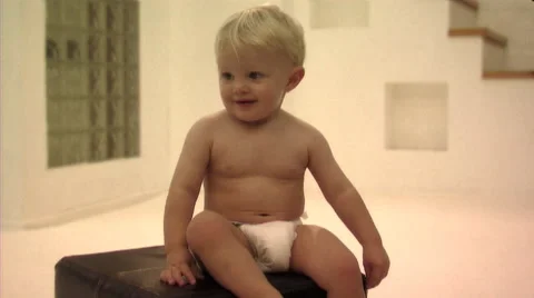 Baby sitting on stool Stock Footage 43695812