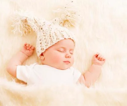 Baby Sleep, Newborn Kid in Woolen Hat Sleeping on White Fur Blanket, New Born Stock Photos