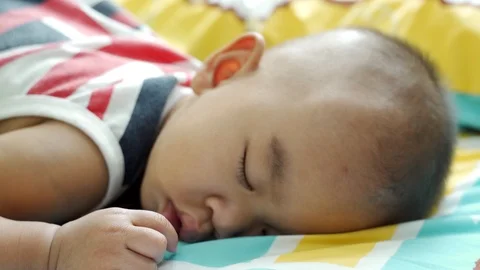 Baby sleeping on bed. Stock Footage 114131087