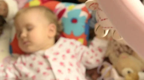 A baby sleeping in a cradle Stock Footage 30761467