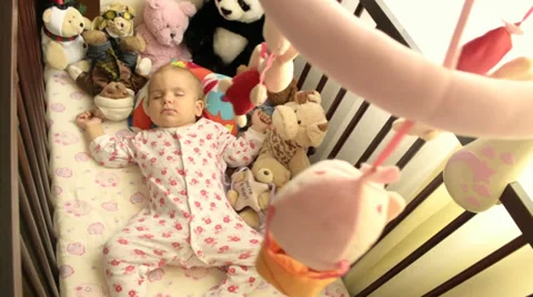 A baby sleeping in a cradle Stock Footage 30761479