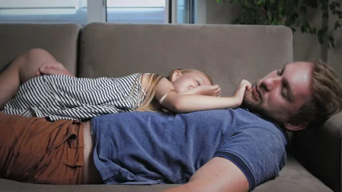 Baby sleeping with dad Stock Footage 132402465