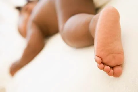 Baby sleeping with focus on foot Stock Photos