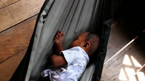 Baby in Sleeping in Hammock Stock Footage 12169092