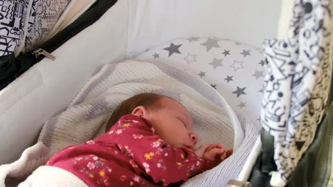 The baby is sleeping in the stroller. selective focus. Stock Footage 265298133