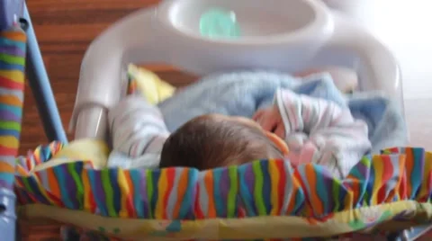 Baby sleeping in a swing Stock Footage 54398885