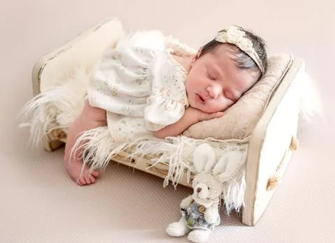 Baby Sleeping In Tiny Crib Stock Photos