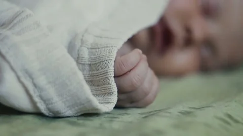 Baby sleeps close-up hand Stock Footage