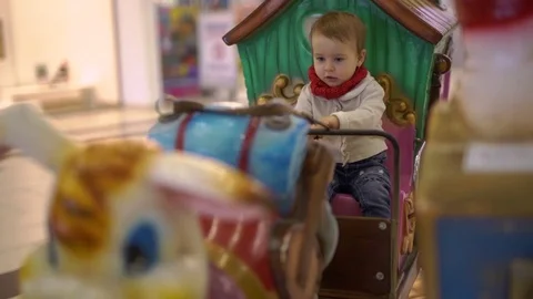 Baby in a small chariot Stock Footage 73326665