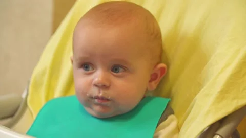 The baby is spoon-fed Stock Footage 140787203