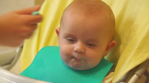 The baby is spoon-fed Stock Footage 140970002