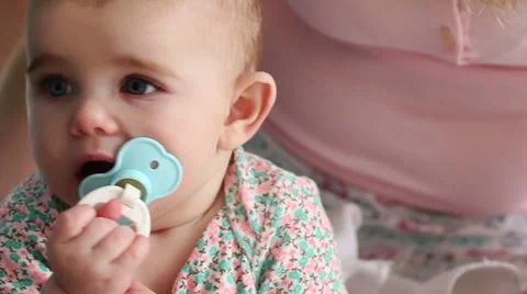 Baby sucking pacifier closeup Stock Footage 47470133