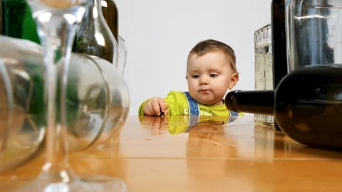 Baby surrounded by empty bottles. Сhild abuse Stock Footage 101360809