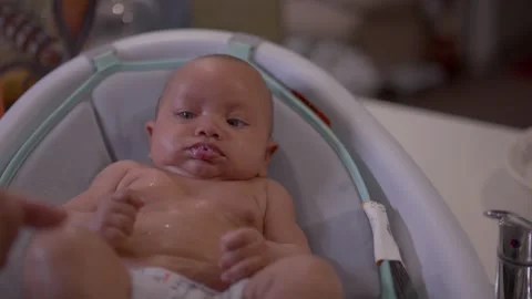 Baby taking a bath Stock Footage 240967271
