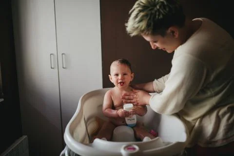 Baby taking a bath Stock Photos