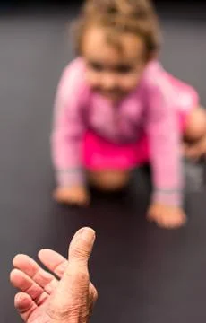 Baby taking first steps Foto stock