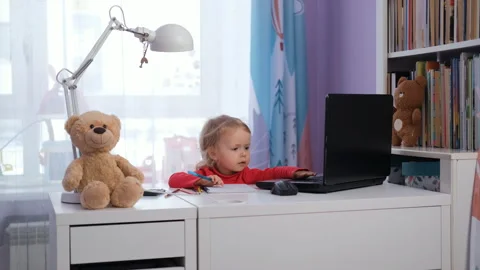 Baby taking notes and using laptop at workdesk Vídeo Stock 297103061