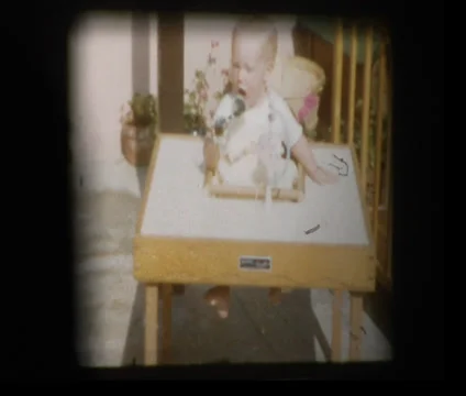 Baby teething on sunglasses Stock Footage 34000459