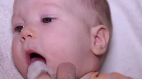 Baby Tongue Cleaning Stock Footage
