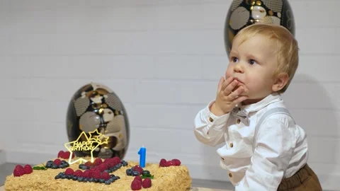 The baby tries cake for the first time Stock Footage 336721710