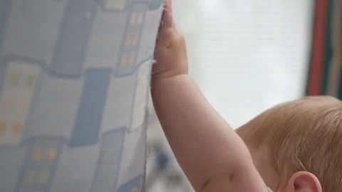 Baby tries to stand up Stock Footage 304999043