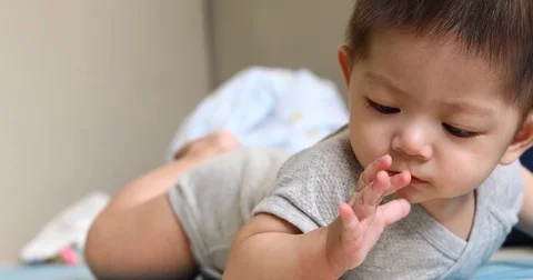 Baby try crawl Stock Footage 84212535