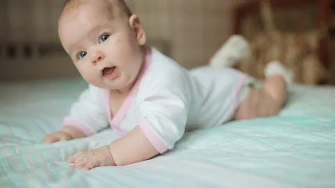 Baby trying to crawl Stock-Footage 82491020
