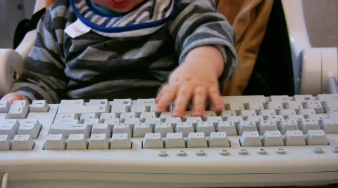 Baby typing on computer keyboard 1 Video stock 354486