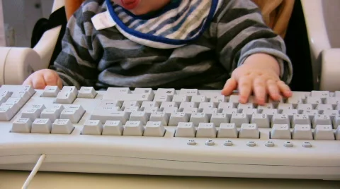 Baby typing on computer keyboard 3 Video stock 354505