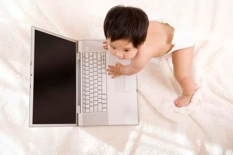 Baby using a computer Stock Photos