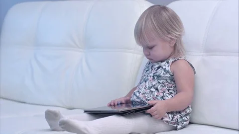 Baby using digital tablet at home Vídeos de archivo 70193552