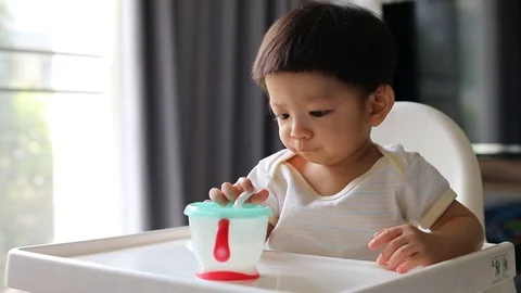 Baby using finger hand playing straw Stock Footage 81794048