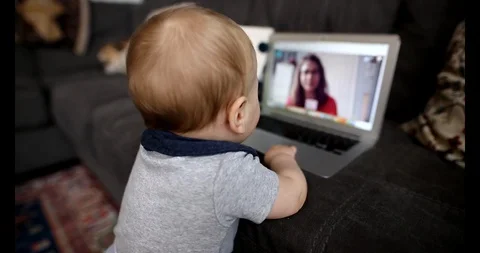 Baby using internet video calls to communicate with family during COVID-19 Stock Footage 129516761