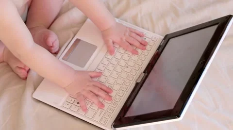 Baby is using a laptop Stock Footage 44175953
