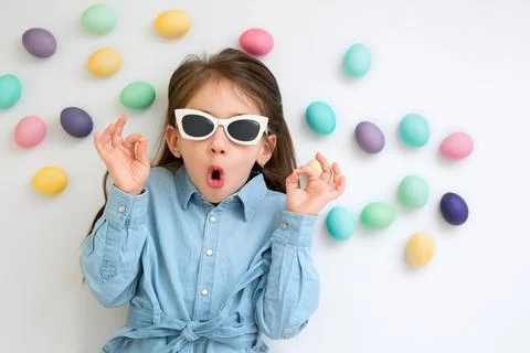 Baby on a white background with Easter eggs. Foto stock