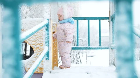 Baby winter on the Playground Stock Footage 101701215