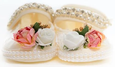 Baby's bootees for the little princess Stock Photos