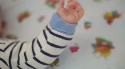Baby's cute tiny hand close up. Childhood concept. Stock Footage 61676498