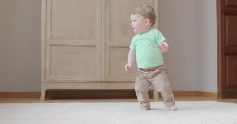 Baby's first independent steps Stock Footage 50163811