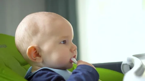 Babys first vegetable feeding Stock Footage 310658624