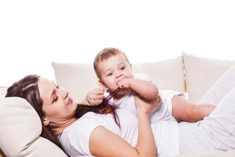 Baby's game on the bed Stock Photos