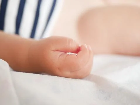 Babys hand. Close-up. A place to write. Placing text. defocusing. Stock Photos