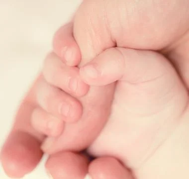 Baby's hand Stock Photos