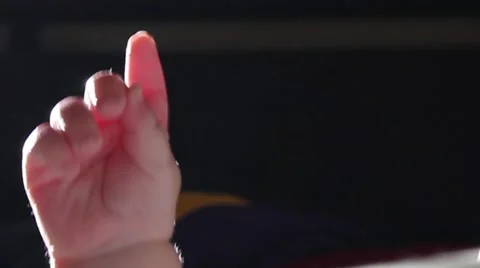 Baby's hand pointing Stock-Footage 58882924