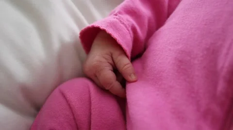 Baby's hand as she sleeps Stock Footage 54282871