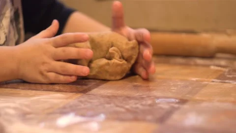 Baby's hands knead the dough 4K Stock Footage 101137488