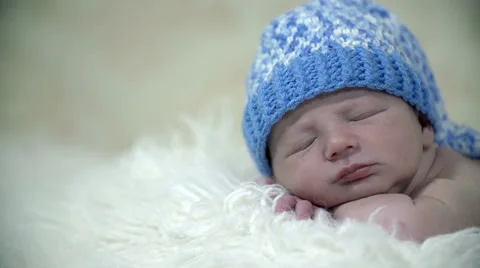 Baby's head with blue hat Stock Footage 33086867