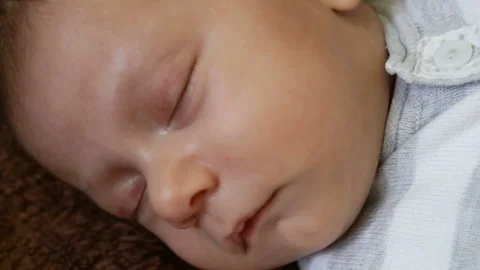 The baby's head close up, infant is asleep. Close-up, top view, real time, natur Stock Footage 86288928