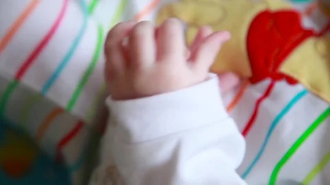 Babys holding hands Stock Footage 73396004