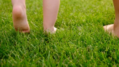 Baby's legs on the grass. Elective focus. Stock Footage 295479204